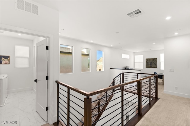 hallway featuring marble finish floor, recessed lighting, visible vents, an upstairs landing, and baseboards