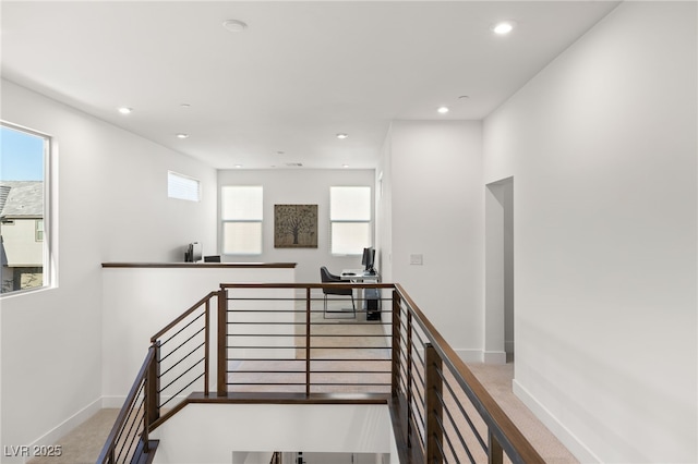 stairs featuring carpet floors, baseboards, and recessed lighting