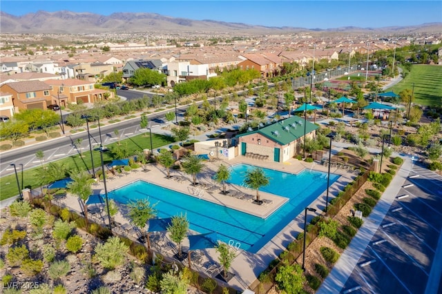 birds eye view of property featuring a mountain view and a residential view