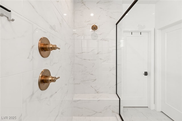 full bath featuring marble finish floor and a marble finish shower