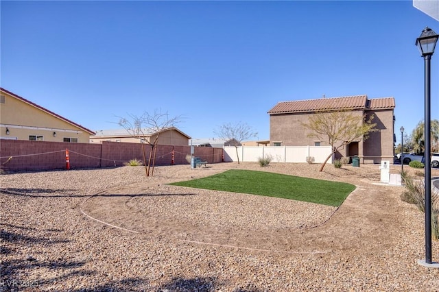 view of yard featuring a fenced backyard