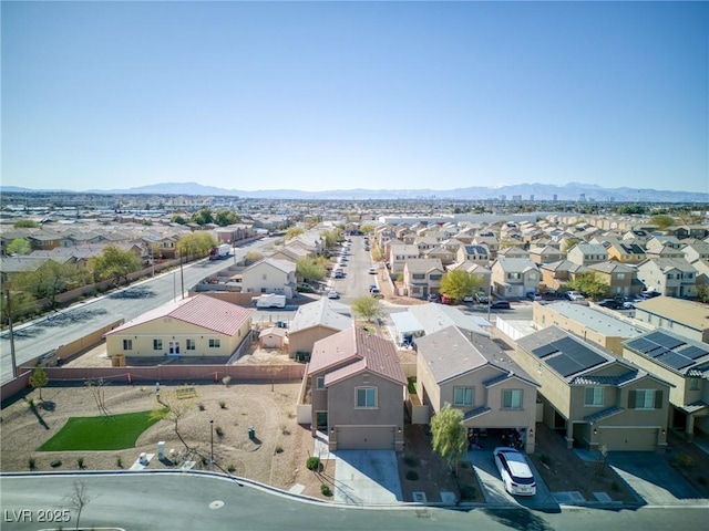 drone / aerial view featuring a residential view and a mountain view