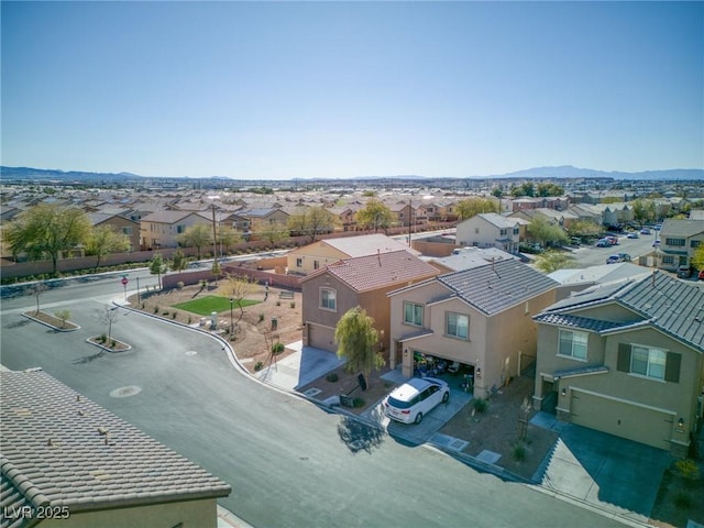 bird's eye view featuring a mountain view and a residential view