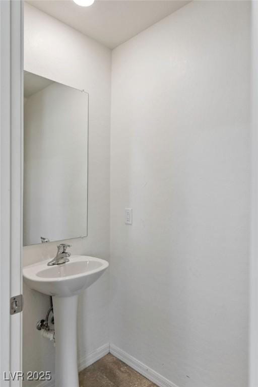 bathroom with baseboards