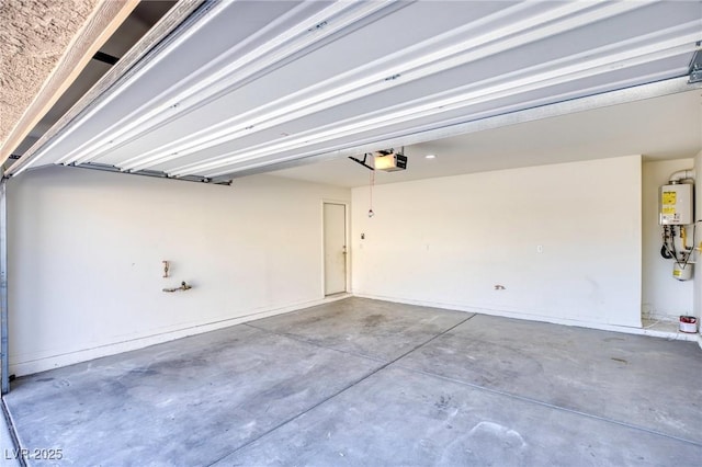 garage featuring water heater and a garage door opener