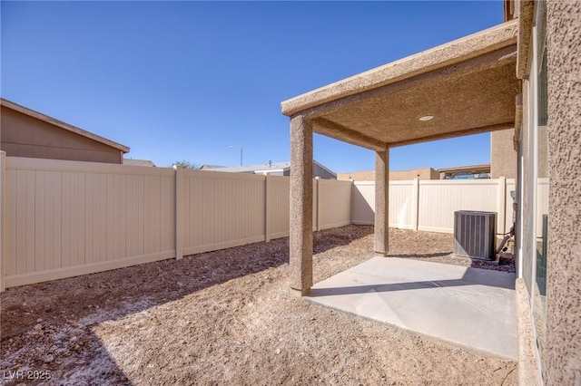 view of patio featuring central AC and a fenced backyard