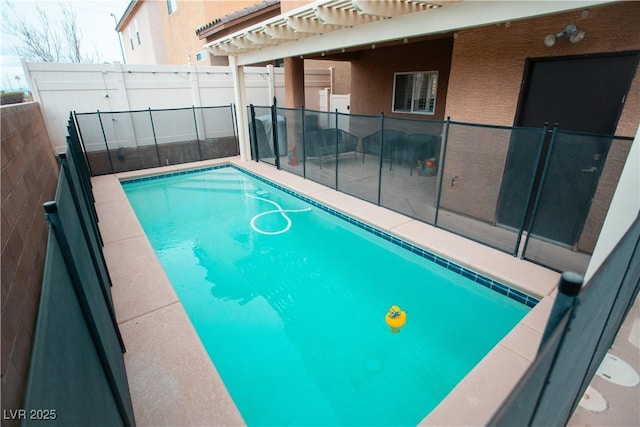 view of swimming pool with a fenced in pool, a pergola, and fence