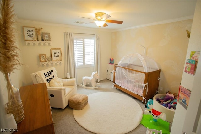 carpeted bedroom featuring ceiling fan, visible vents, and ornamental molding