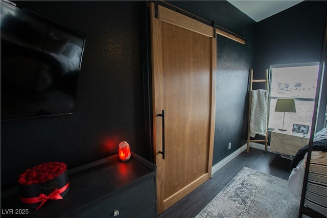 bathroom with baseboards and wood finished floors