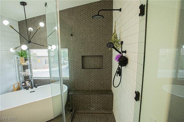 full bathroom with a stall shower, tile walls, and a freestanding tub