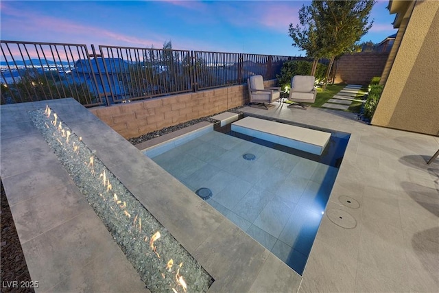 view of swimming pool with a patio and a fenced backyard