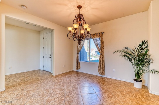 unfurnished room with baseboards and an inviting chandelier