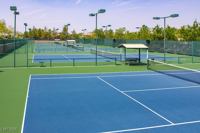 view of tennis court with fence