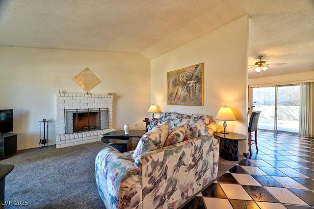 carpeted living area with a ceiling fan, lofted ceiling, a fireplace, and a textured ceiling