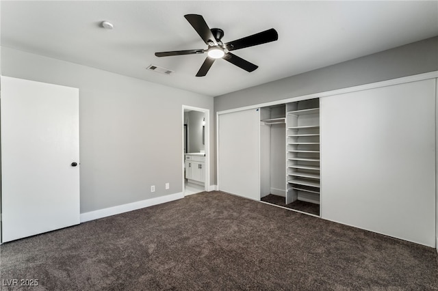 unfurnished bedroom featuring baseboards, visible vents, connected bathroom, carpet flooring, and a closet