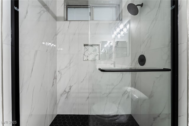 full bath featuring a marble finish shower