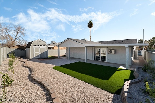 rear view of property featuring an outbuilding, a patio, a shed, and a fenced backyard