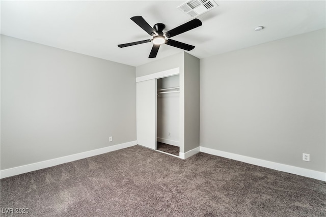 unfurnished bedroom featuring a closet, visible vents, carpet flooring, ceiling fan, and baseboards