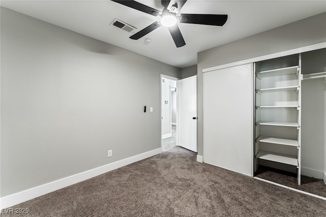 unfurnished bedroom featuring visible vents, baseboards, a ceiling fan, carpet, and a closet