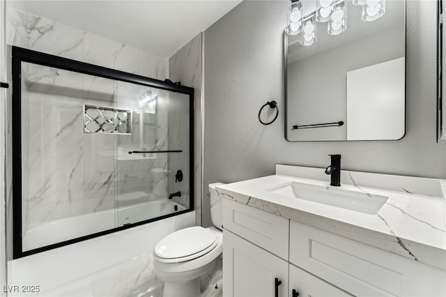 bathroom featuring a textured wall, shower / bath combination with glass door, vanity, and toilet