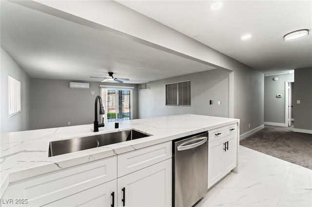 kitchen featuring light stone counters, a sink, white cabinets, marble finish floor, and dishwasher