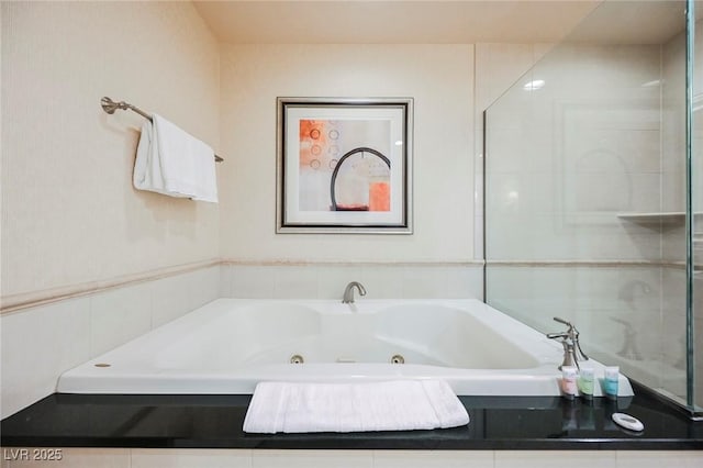 full bathroom featuring a whirlpool tub