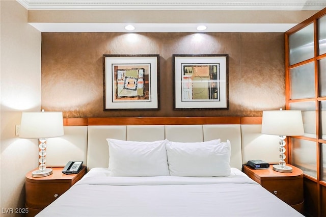 bedroom featuring ornamental molding and recessed lighting