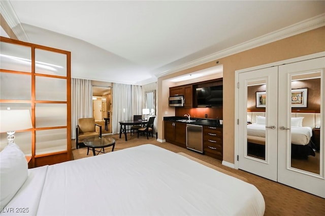 bedroom with light carpet, ornamental molding, a sink, and french doors