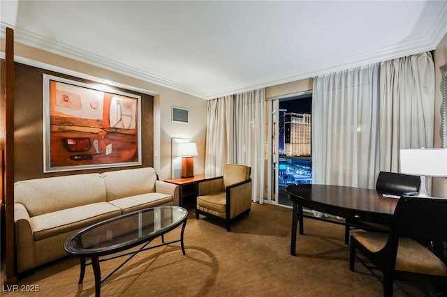 living area featuring ornamental molding and visible vents