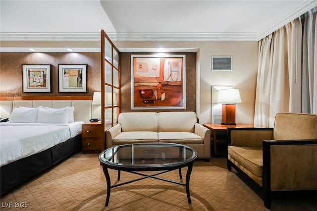 bedroom with ornamental molding and visible vents