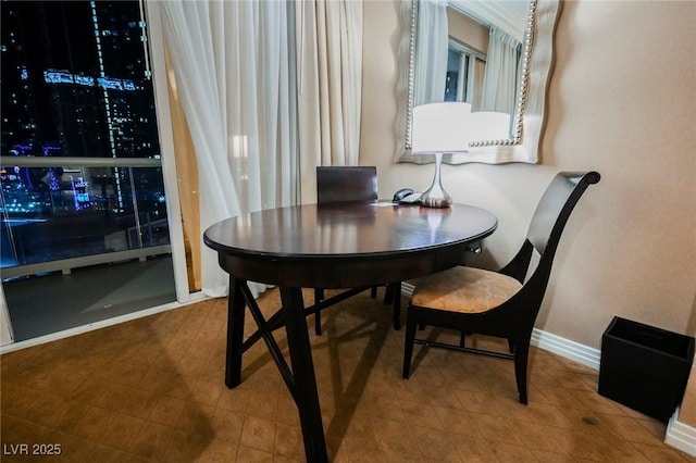 dining area featuring baseboards