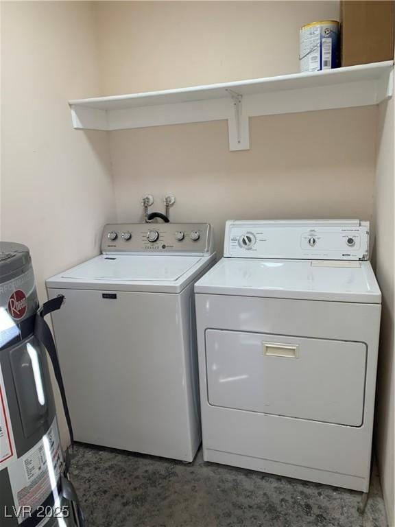 washroom featuring laundry area and washing machine and clothes dryer