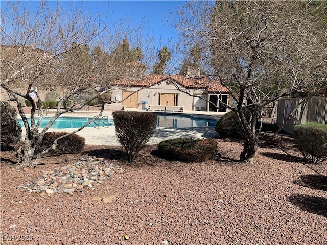 view of pool featuring a patio, fence, and a fenced in pool