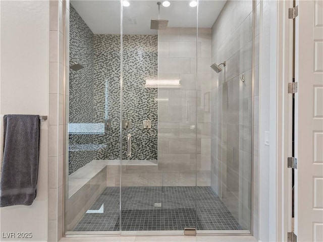 bathroom with a shower stall