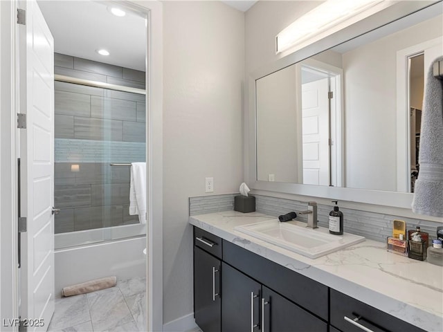 full bath featuring vanity, recessed lighting, marble finish floor, and enclosed tub / shower combo