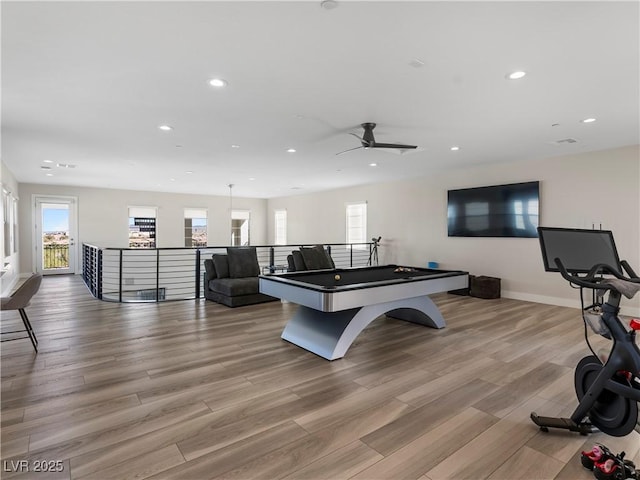 recreation room with recessed lighting, baseboards, and wood finished floors