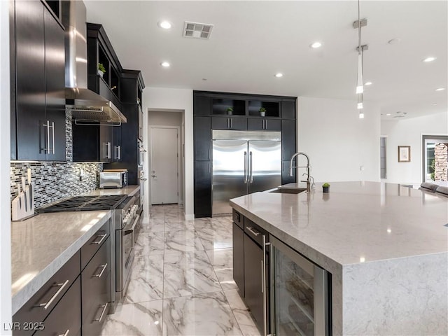 kitchen featuring visible vents, wine cooler, high quality appliances, marble finish floor, and a sink