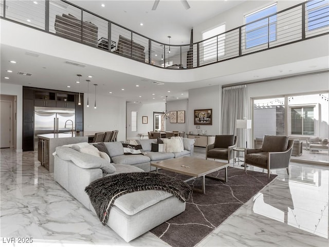 living room with recessed lighting, visible vents, marble finish floor, and a ceiling fan