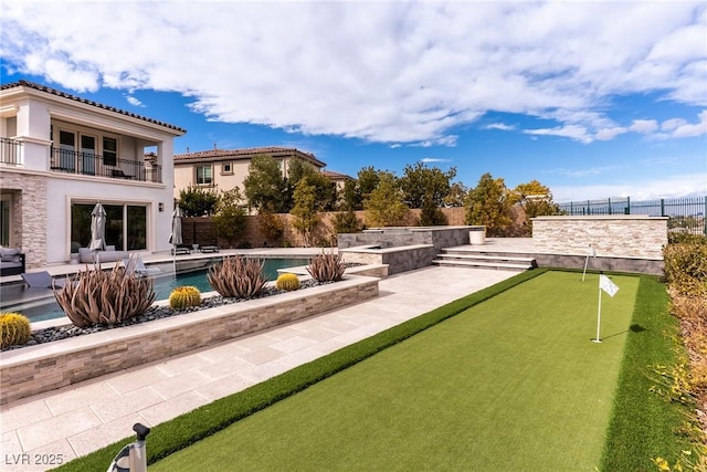 surrounding community featuring a patio, a pool, and fence