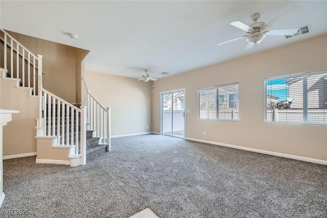 unfurnished living room with baseboards, visible vents, carpet flooring, and stairs