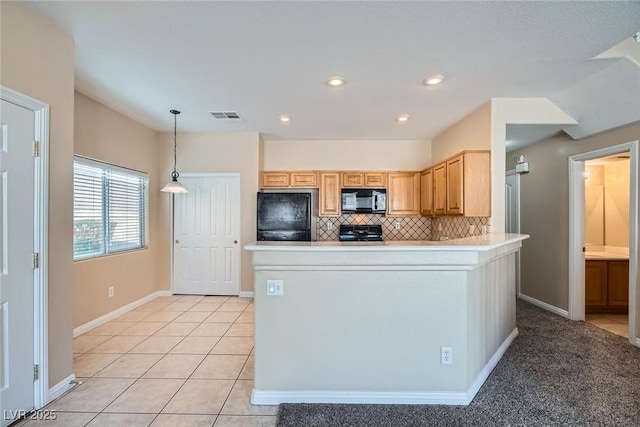 kitchen with tasteful backsplash, visible vents, black appliances, and light tile patterned floors