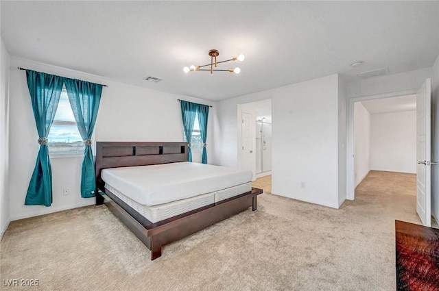 carpeted bedroom featuring visible vents and a notable chandelier