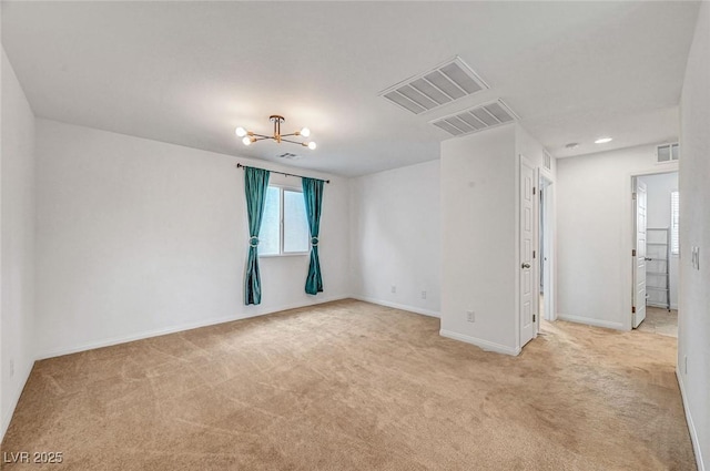 spare room with light carpet and visible vents