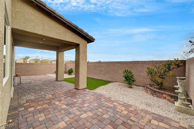 view of patio with a fenced backyard