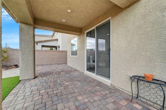 view of patio / terrace featuring fence