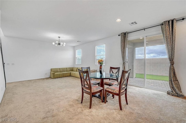 dining area featuring recessed lighting, visible vents, a notable chandelier, and light carpet