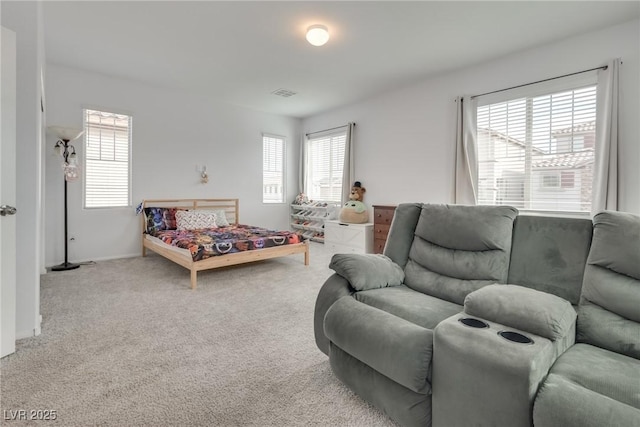 carpeted bedroom with baseboards and visible vents