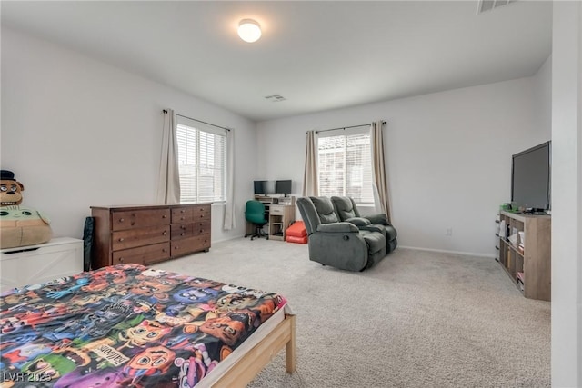 bedroom with light colored carpet, multiple windows, and visible vents