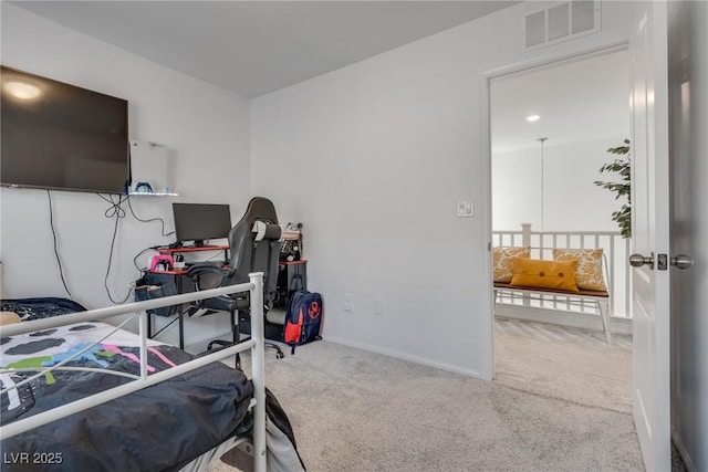 carpeted bedroom featuring visible vents and baseboards