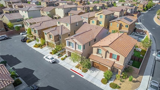 birds eye view of property with a residential view